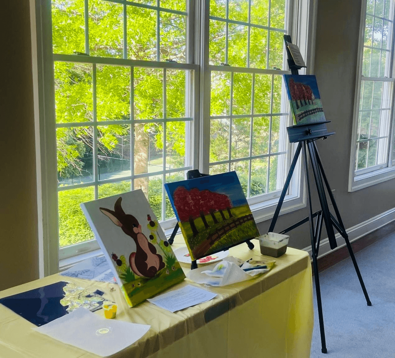 Children enjoying canvas painting activity