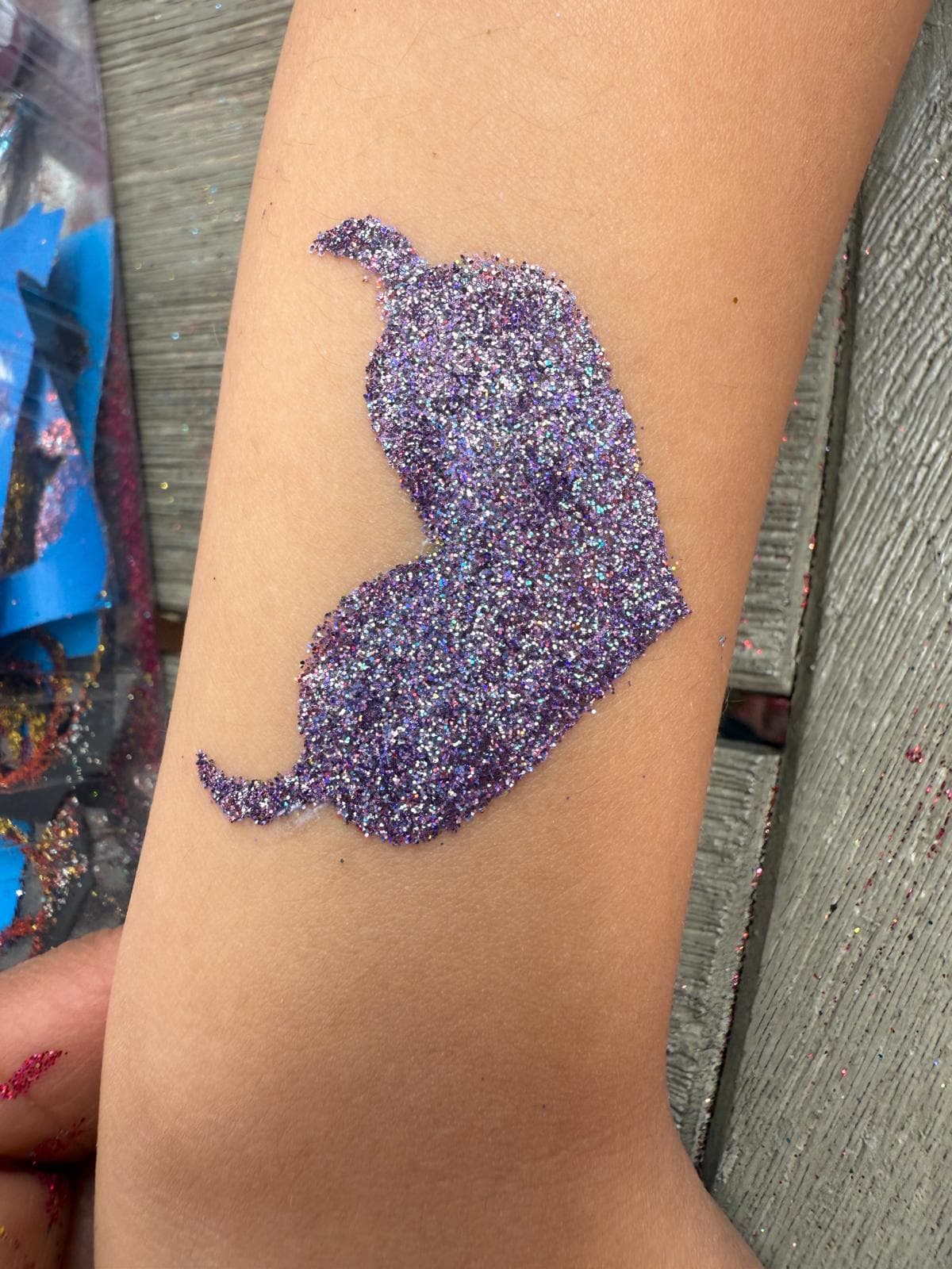 Creative glitter tattoo design