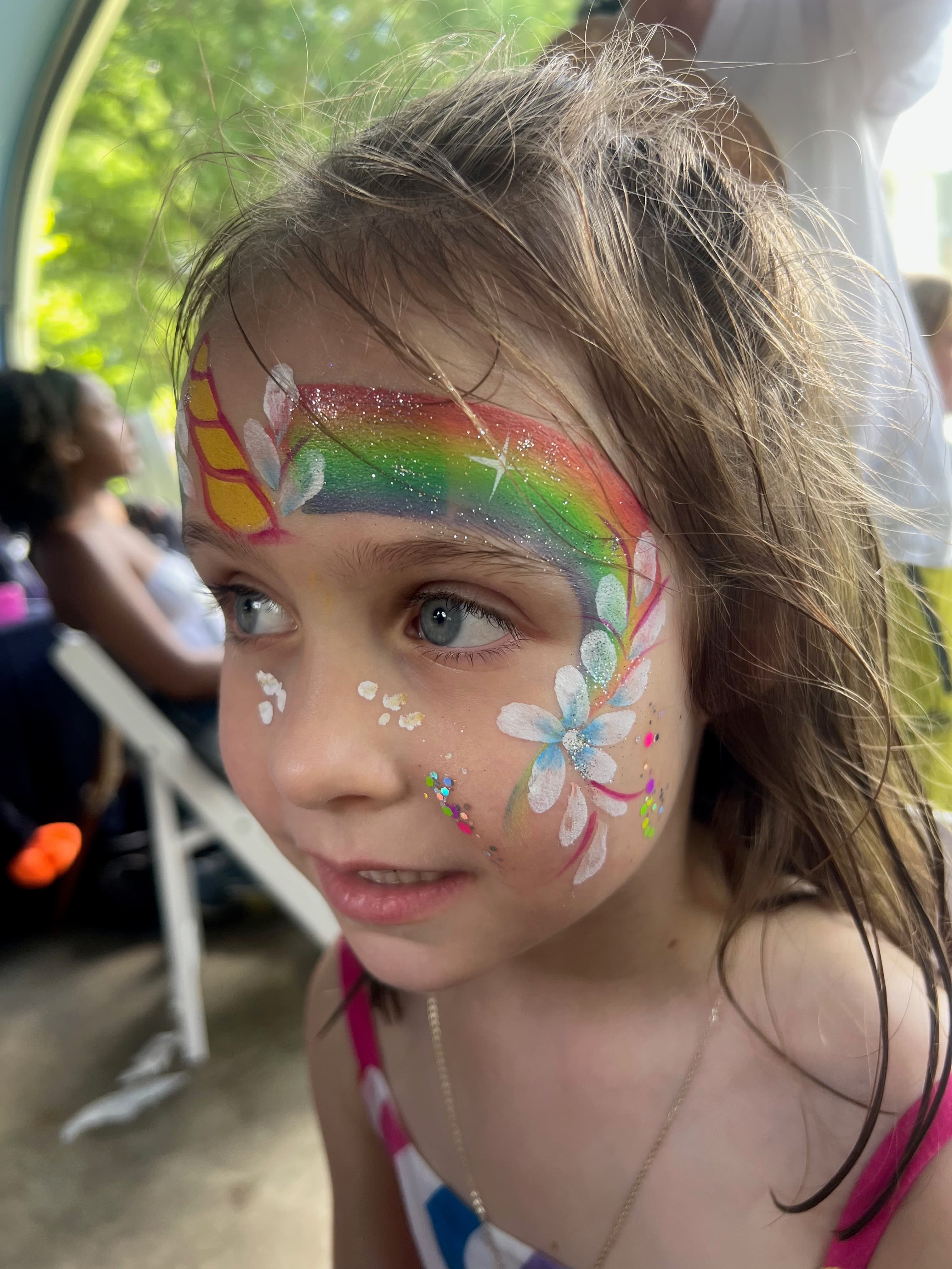 Rainbow unicorn face painting art